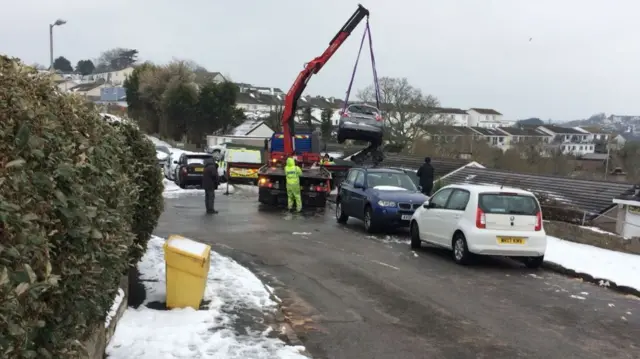 Car being removed in Looe