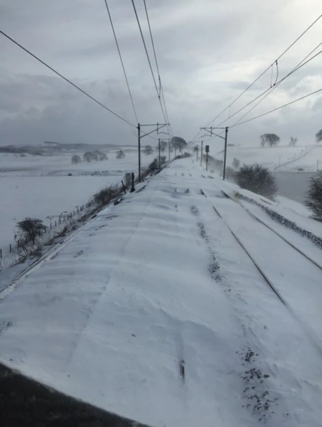 Rail lines covered in drifts