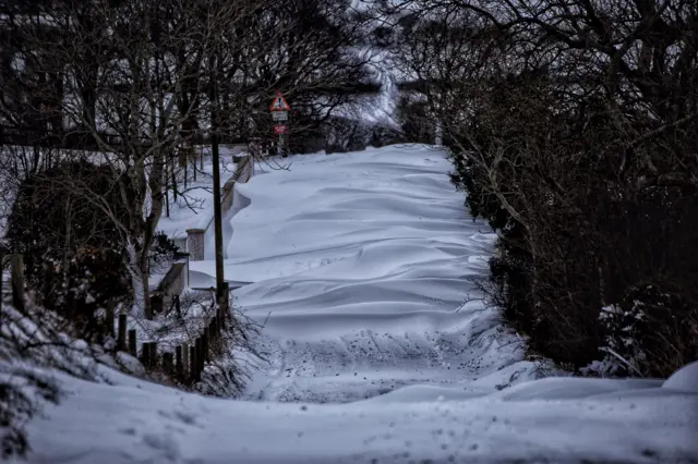 A snow covered road in Katesbridge, Dromara, County Down.