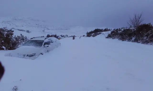 Car in a snow drift at Strathkanaird