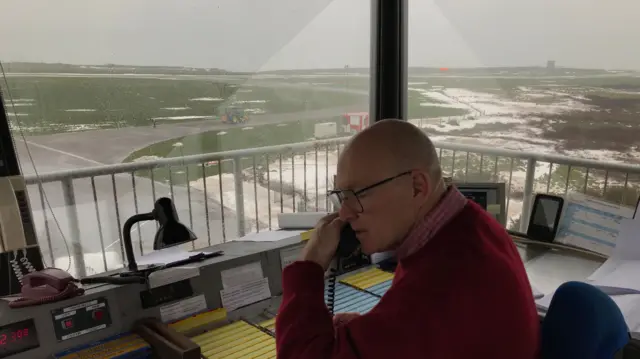 A member of staff at Alderney airport control tower
