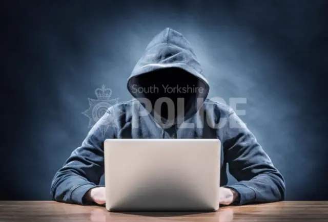 Man in front of laptop