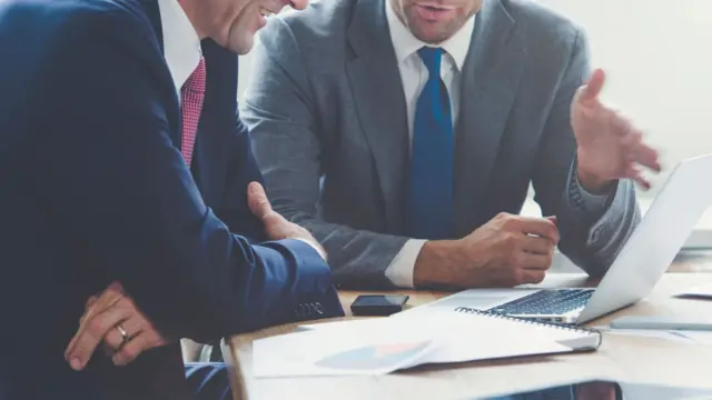 Men talking in an office