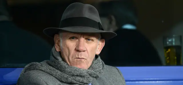 Peter Reid watching football in a nice hat