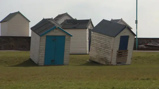 Damaged beach huts in Torbay