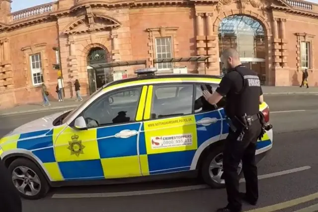 Ricky Slade in police car