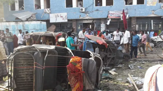 A picture showing people surveying the scene