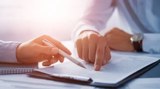 Two men looking at a document