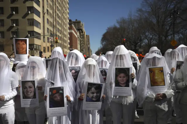 In New York, protesters held photos of gun violence victims