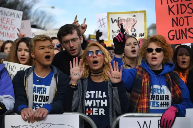 People arrive for the March For Our Lives rally against gun violence in Washington, DC.