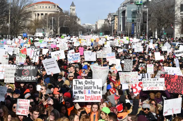 People arrive for the March For Our Lives rally against gun violence in Washington, DC.