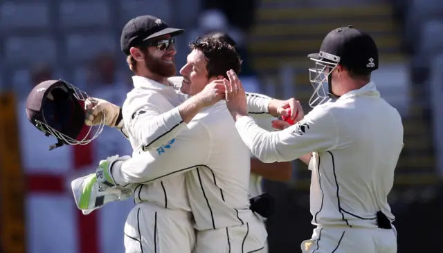 Kane Williamson (left) celebrates his catch