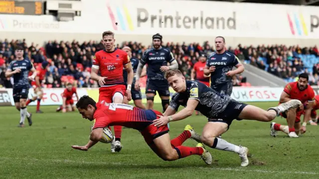 Jackson Willison of Worcester Warriors scores a try during the game