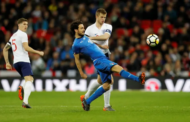 Eric Dier in action with Italy"s Marco Parolo