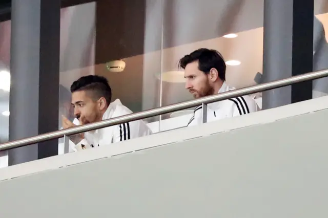 Lionel Messi watches Argentina against Spain from the stands