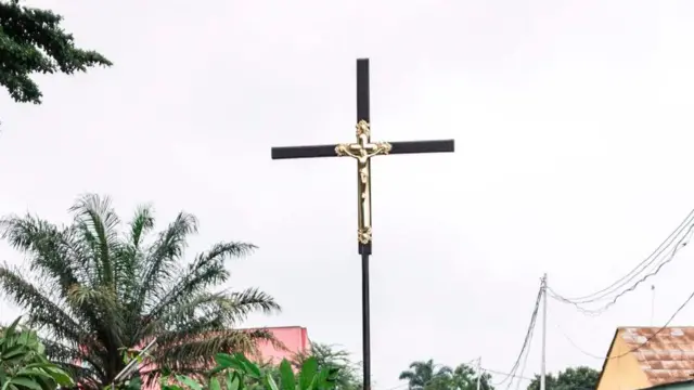 A cross being held aloft in the Democratic Republic of Congo