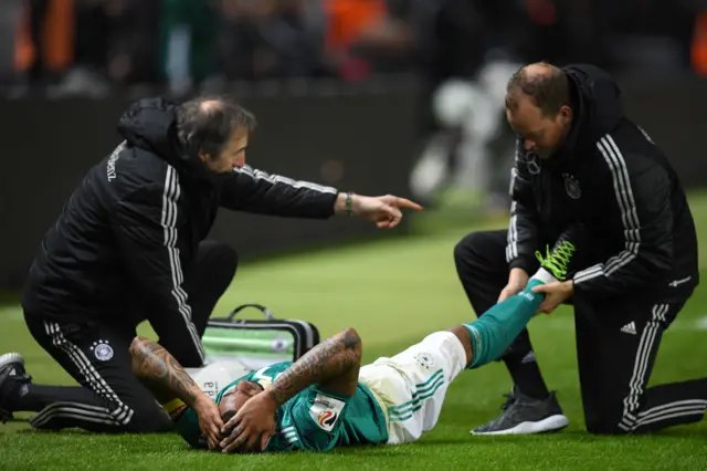 Boateng is treated by the Germany medical team