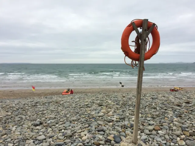 Shot of beach with lifeboats