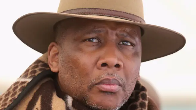 His Majesty King Letsie III of Lesotho looks on at the opening ceremony of the new Sentebale Mateanong Herd Boy School on October 14, 2013 in Mokhotlong, Lesotho. Sentebale provides healthcare and education to the vulnerable children of Lesotho, a land-locked mountainous South African Kingdom.