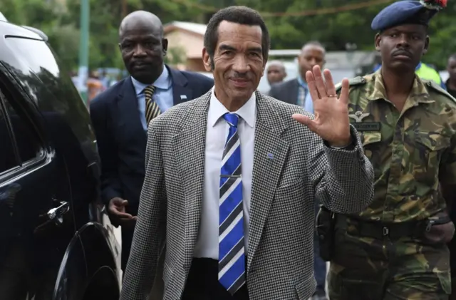 Seretse Ian Khama waves to the crowd as he leaves after a rally in his village Serowe on March 27, 2018