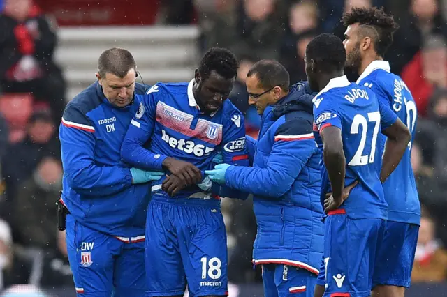 Diouf departs clutching his arm