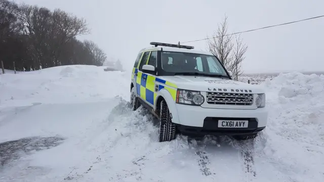 North Wales Police car stuck in snow