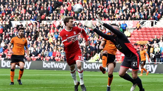 Patrick Bamford and John Ruddy challenge for the ball