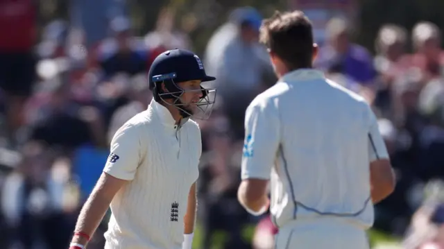 Joe Root walks off