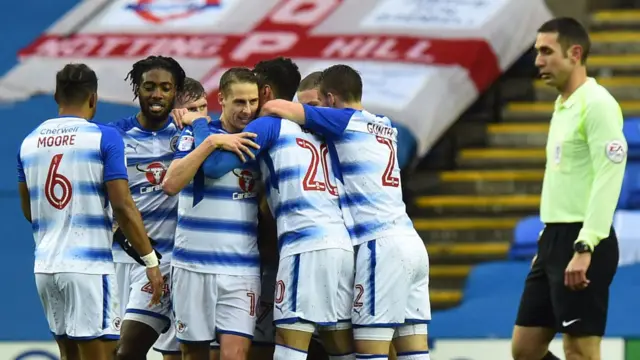 Reading celebrate a goal against QPR