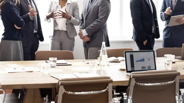 Workers in a boardroom