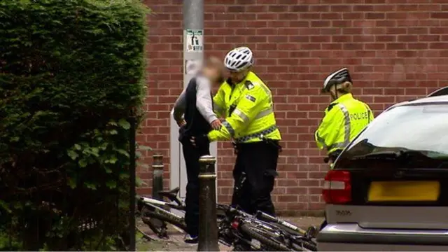 Police officer searching a young person