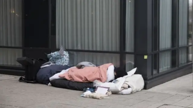 Homeless man sleeping rough