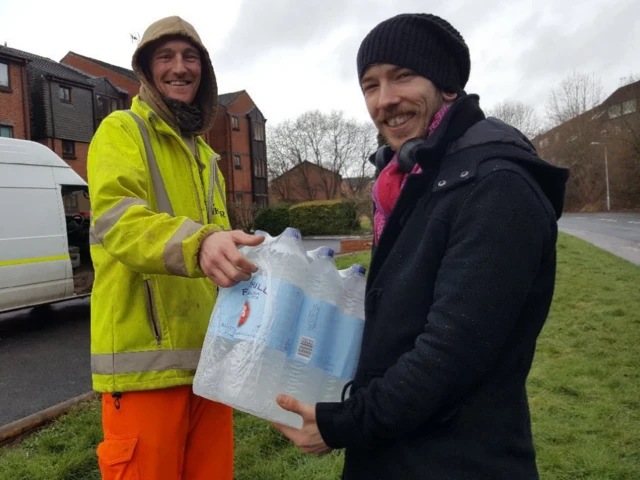 Bottles of water being handed out