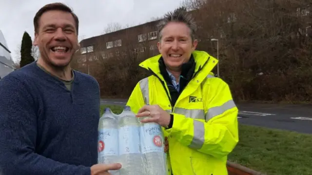 Bottles of water being handed out