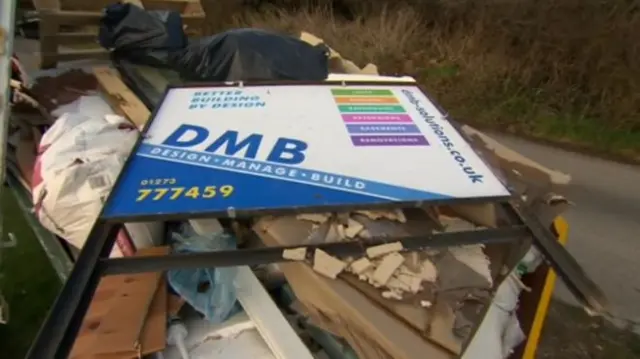 DMB Solutions sign in a skip