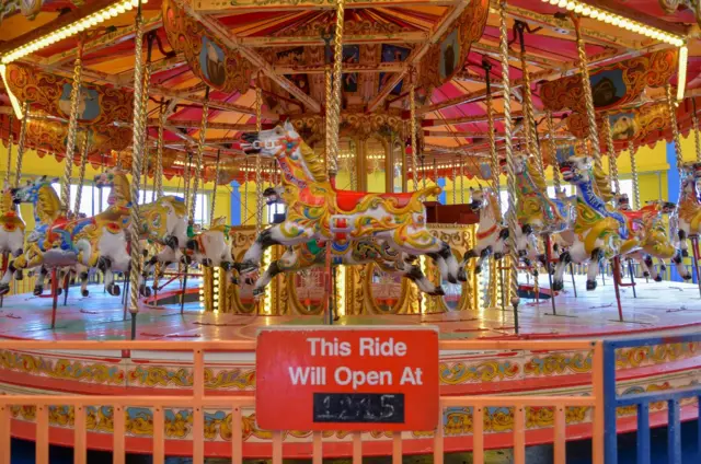 The carousel at Pleasure Island with painted horses.