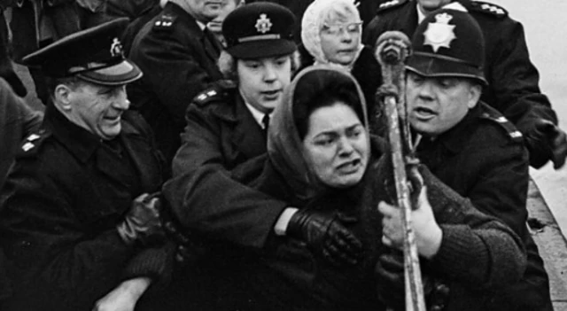 Lillian Billoca being held back by police officers in 1968.