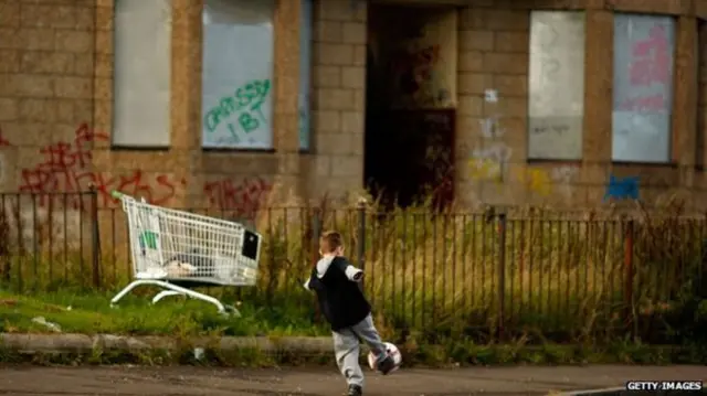 Child playing in deprived area