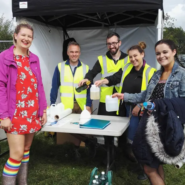 Village Water employees during a bottle swap at V Festival last year