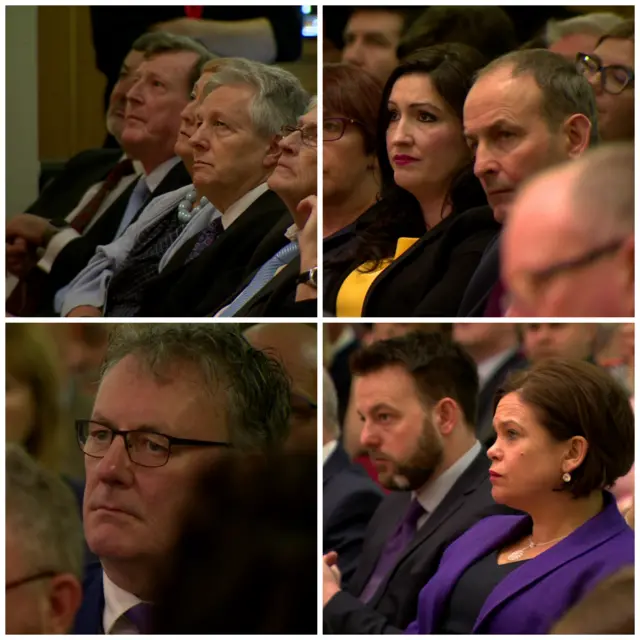 Politicians listening to George Mitchell's speech at Queen's University