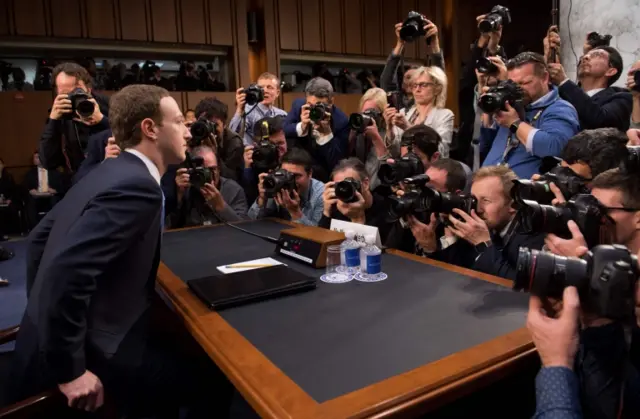 Zuckerberg takes his seat