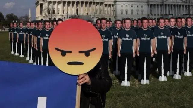 Angry emoji in front of zuckerberg