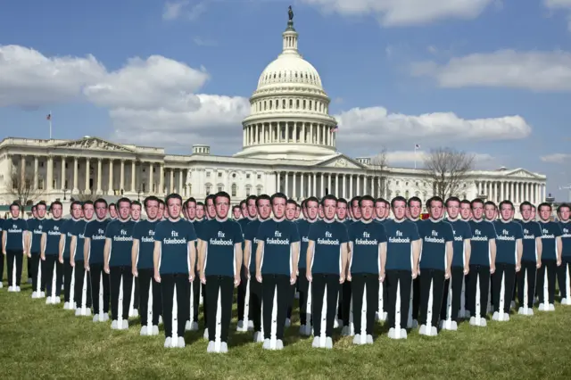 Cardboard cut-outs of Mark Zuckerberg outside the US Capitol