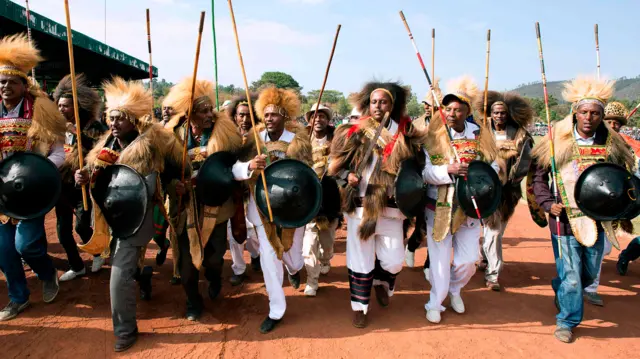 Men in traditional Oromo clothing perform during the rally of Ethiopia's new Prime Minister in Ambo