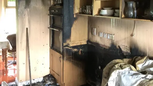 Blackened cupboards in kitchen