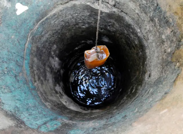 Water is drawn from a well in Abidjan, Ivory Coast.