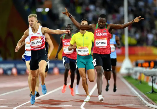 Kenyas Wycliffe Kinyamal (R) wins in front of Englands Kyle Langford (L) in the athletics men's 800m final during the 2018 Gold Coast Commonwealth