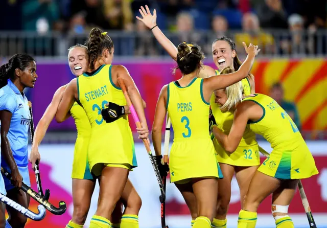 Australia's hockey team celebrate scoring against India in the women's semi-final