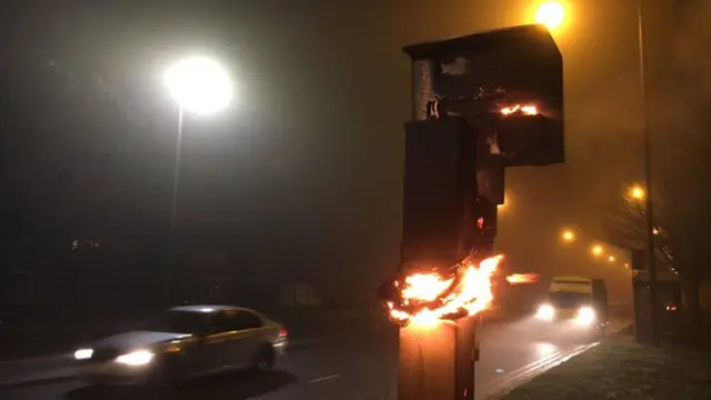 Speed camera on fire on road