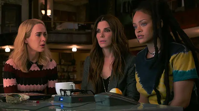 Rihanna alongside Sandra Bullock and Kristen Wiig